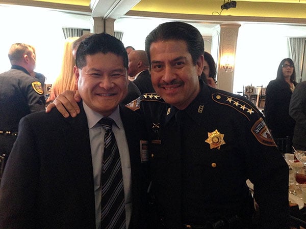 Jason Luong with a police officer